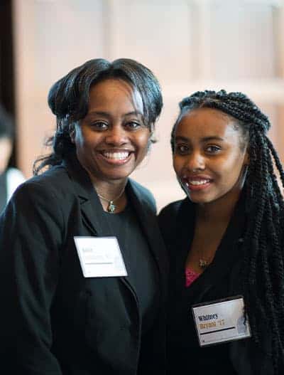 Whitney and Kacie, two Notre Dame alumna pose at an event.